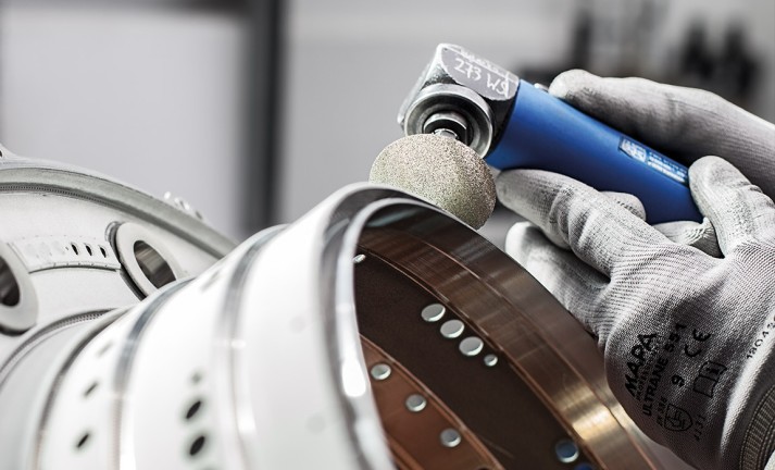 Removing coatings with COMBIDISC diamond abrasive discs.