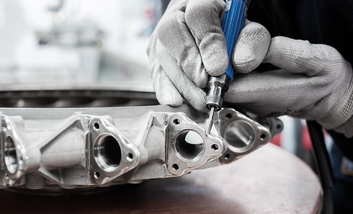Surface finishing of a diffuser with a conical tungsten carbide burrs with radius end.