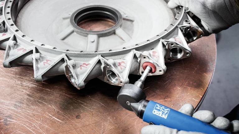 Non-woven material as an abrasive